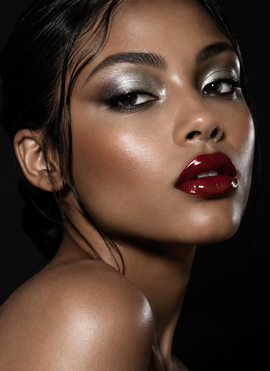 High-fashion beauty portrait with silver eyeshadow and glossy red lipstick